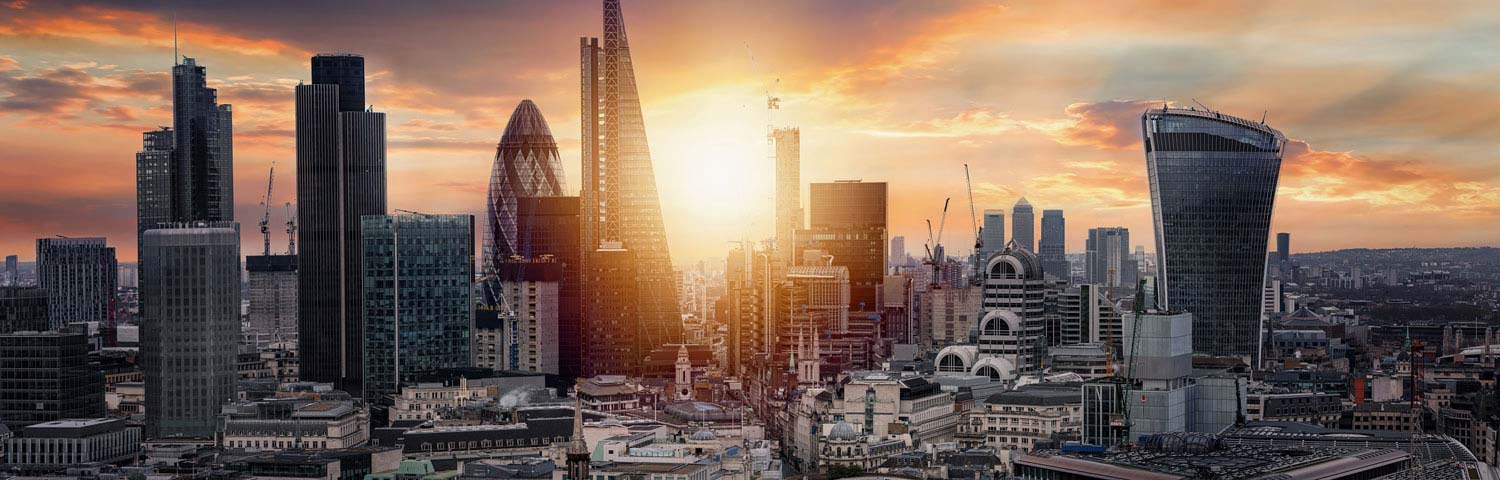 Moving to the UK - the london city skyline, showing the skyscrapers at sunset.