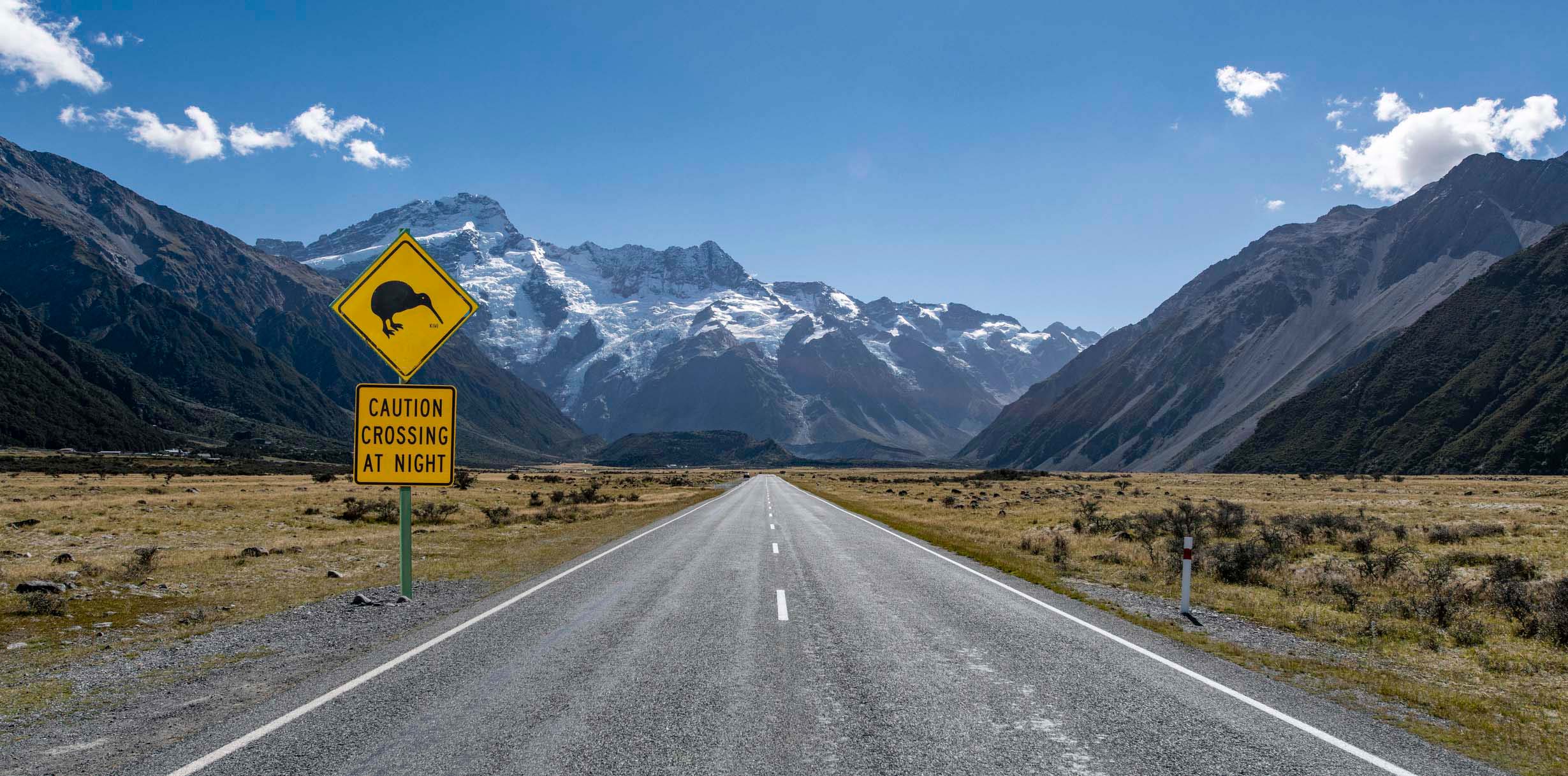 A kiwi bird sign on the road to Mt Cook National Park, south island of New Zealand, seen during a summer day in these southern alps.