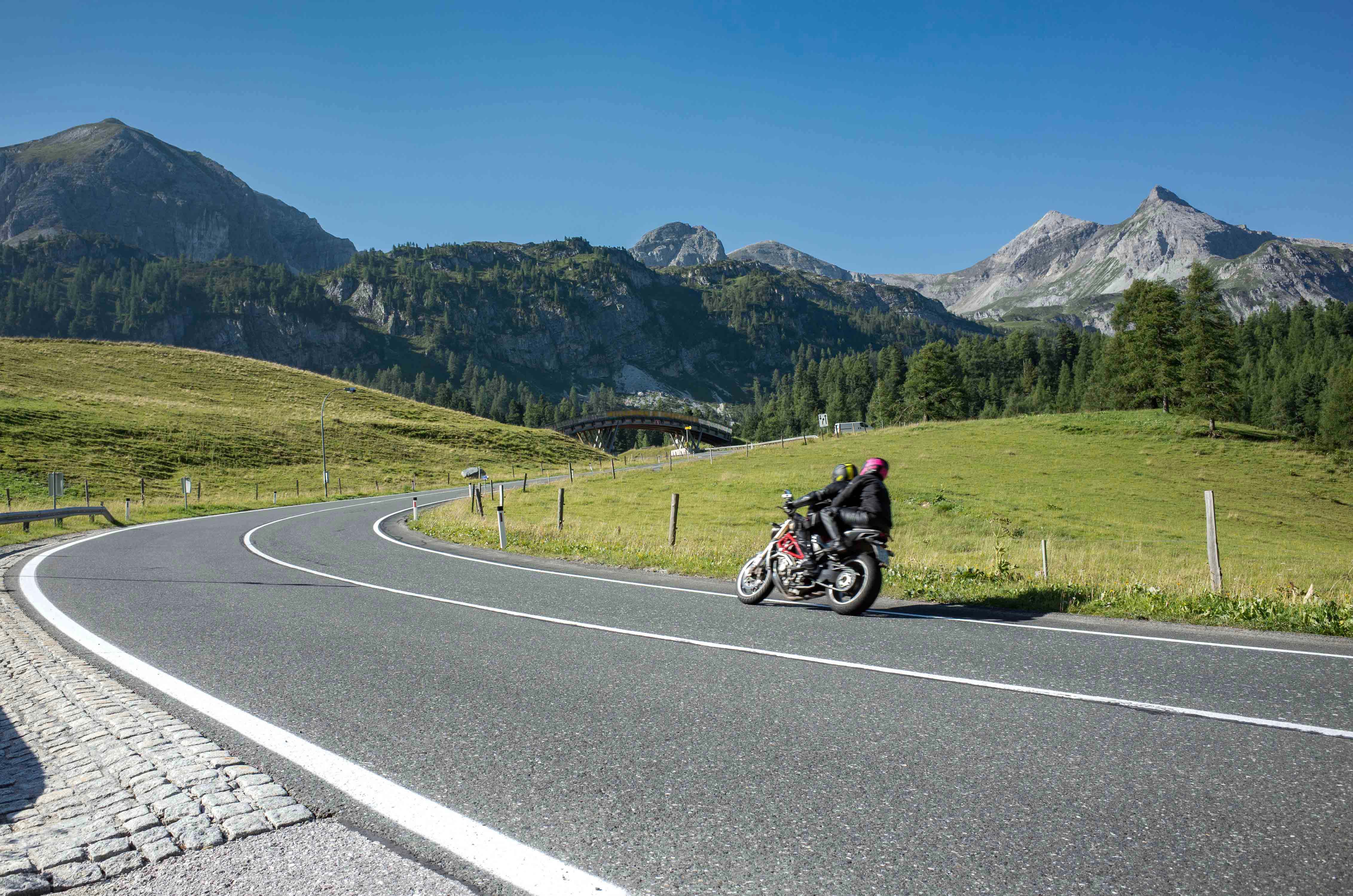 Close view on the motorbike on the route in the mountains