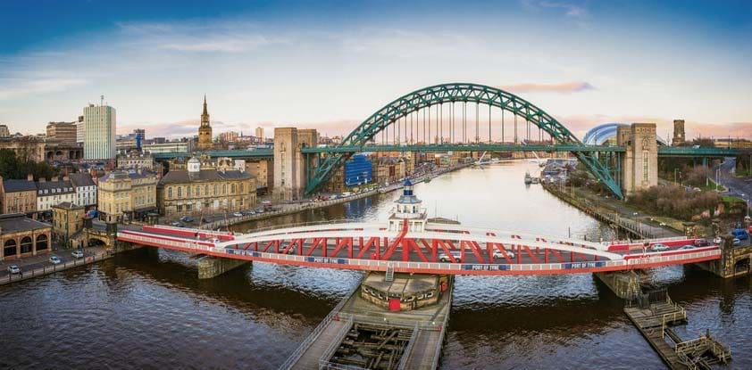 Taken at sunset, a view looking down the River Tyne in central Newcastle. The Swing Bridge, Tyne Bridge and Gateshead Millennium Bridge over the river are visible.
