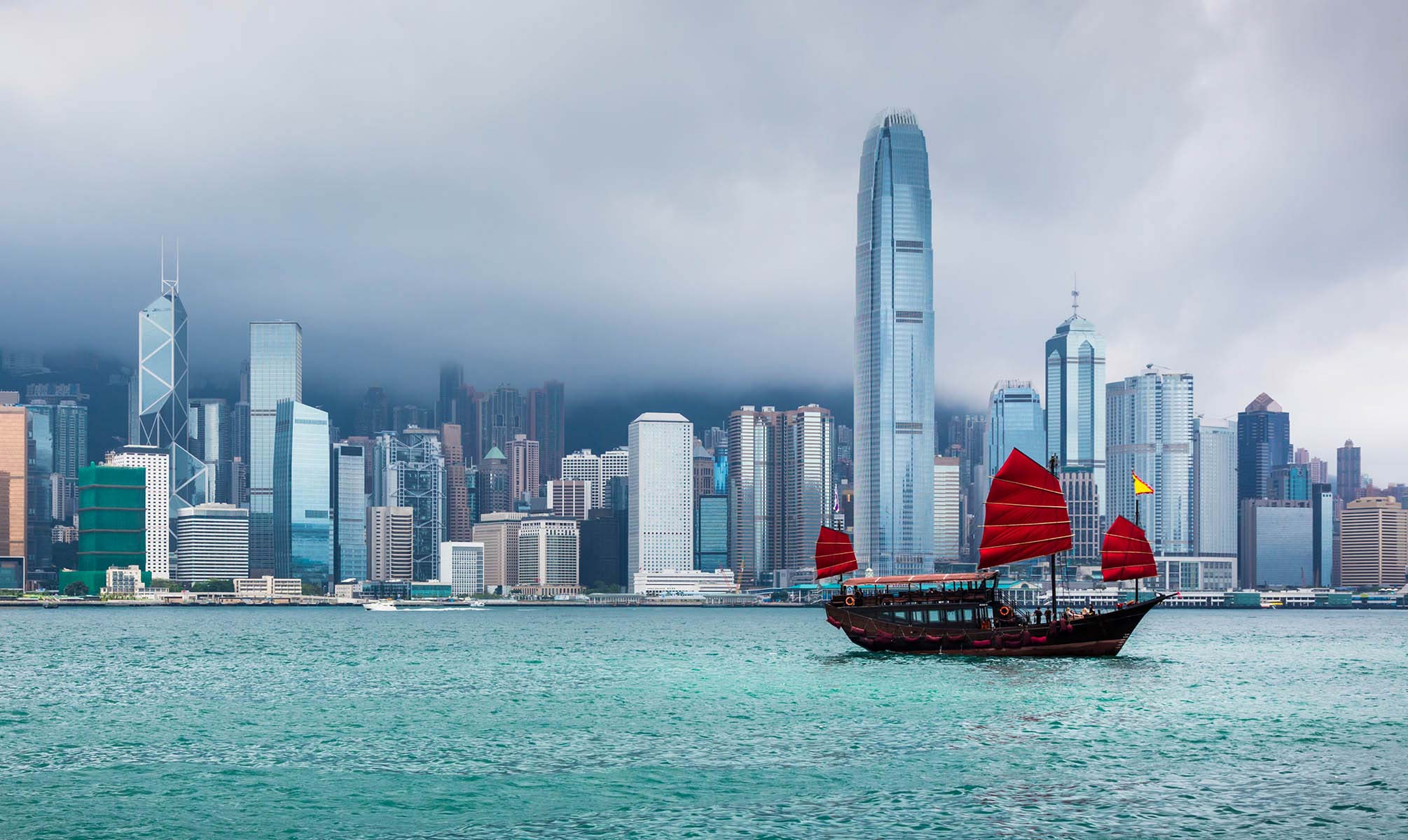 Traditional Chinese Junkboat sailing across Victoria Harbour, Hong Kong