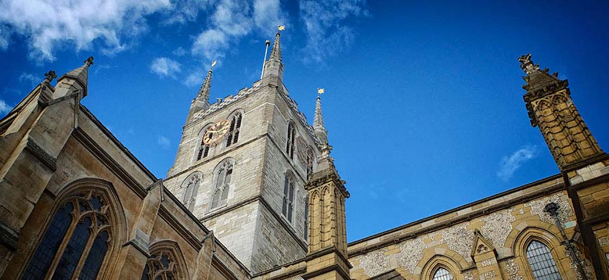 View from the ground looking upwards at the tower of Southwark Cathedral.