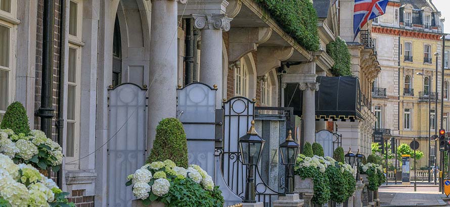 A side view of the frontage of the Goring Hotel in Belgravia, and a view down the road.