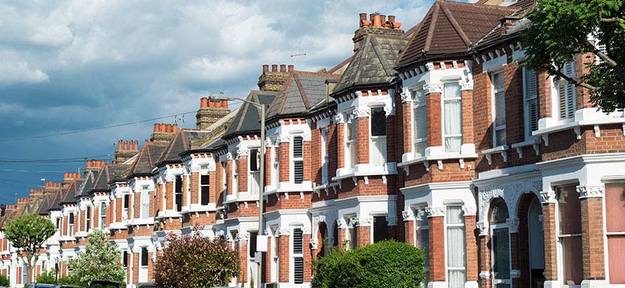 A row of terraced, red brick houses in Clapham, London UK.