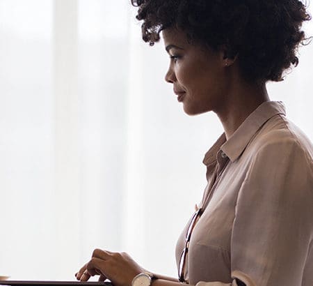 Woman typing on laptop