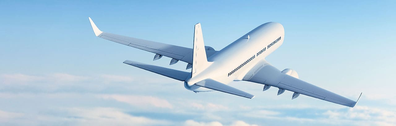 aircraft flying above clouds