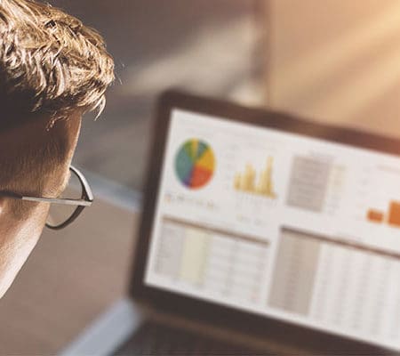 man looking at analytics on screen