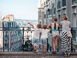 Family taking in the view of their home, a beautiful European city. After a successful international move from Hong Kong using Santa Fe Relocation. 